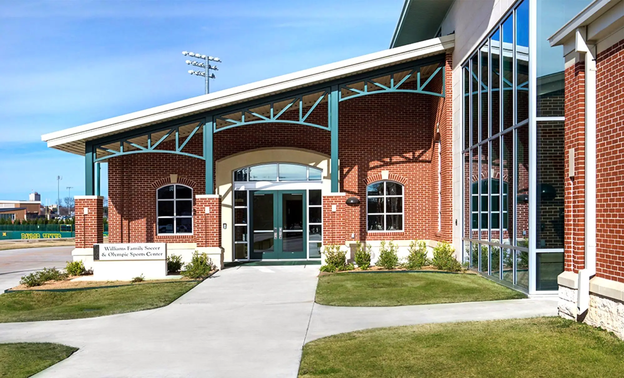 Williams Family Soccer and Olympic Sports Center at Baylor, with maintained lawn and entry beds.